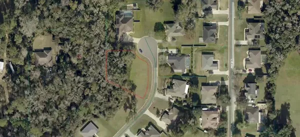 an aerial view of residential house with outdoor space