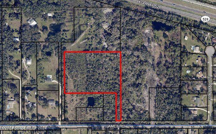 0 James Road Cocoa, FL 32926 - Photo 7 of 7 a street sign on a road in front of building