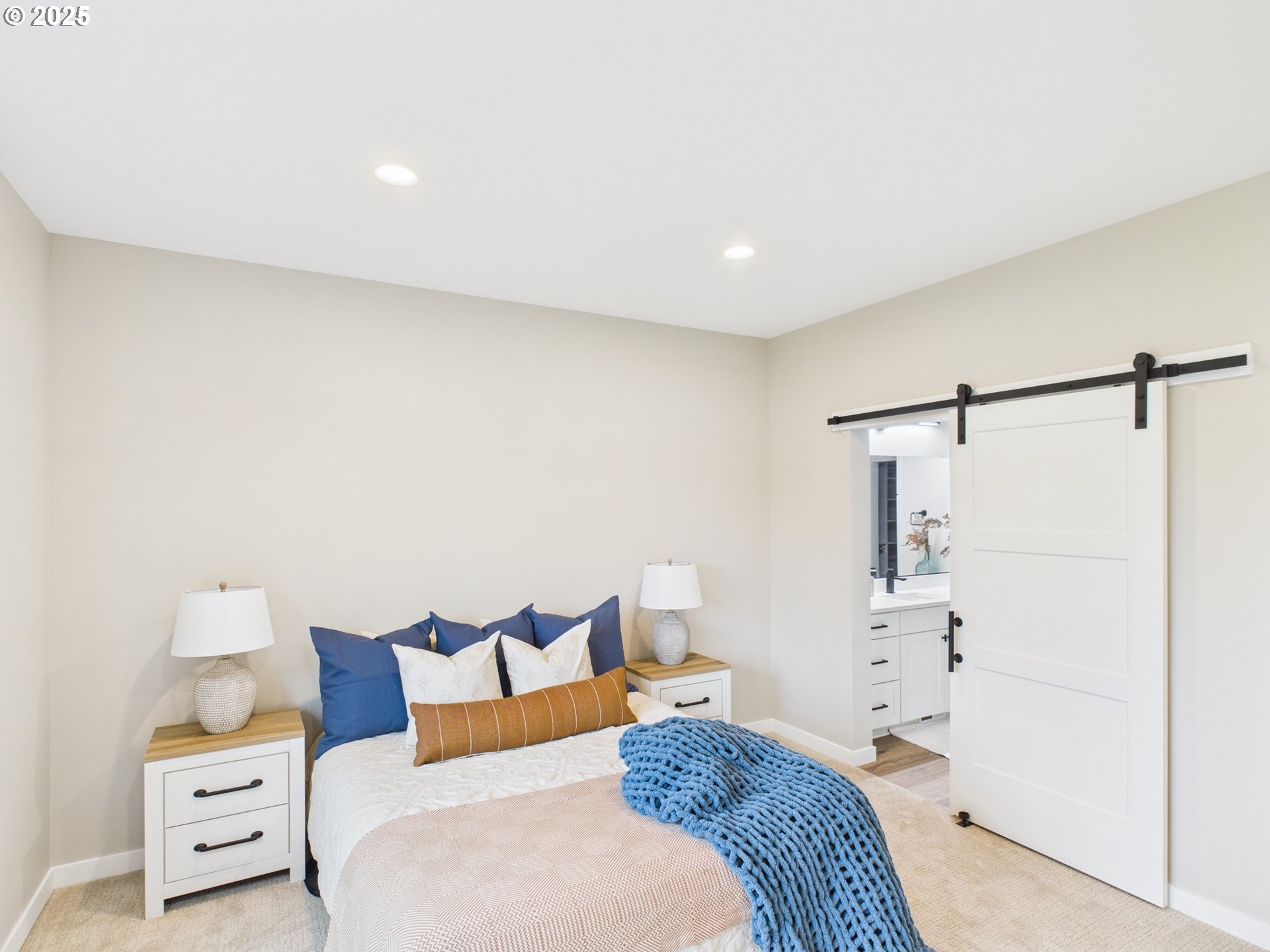 1269 Avenue D Seaside, OR 97138 - Photo 20 of 22 a bedroom with a bed and a night stand