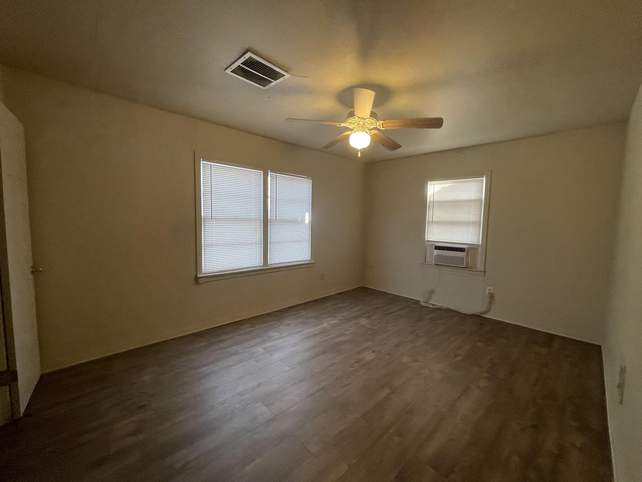 4303 42nd Street Lubbock, TX 79413 - Photo 9 of 10 a view of an empty room with a window