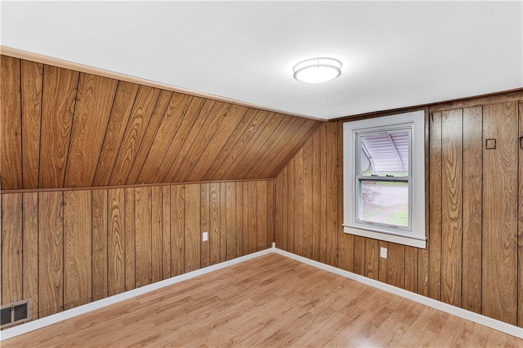 514 Kings Road Apollo, PA 15613 - Photo 14 of 33 a view of an empty room with wooden floor and a window