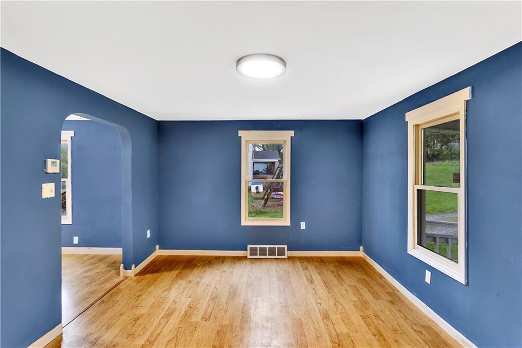 514 Kings Road Apollo, PA 15613 - Photo 5 of 33 a view of an empty room with a window and wooden floor
