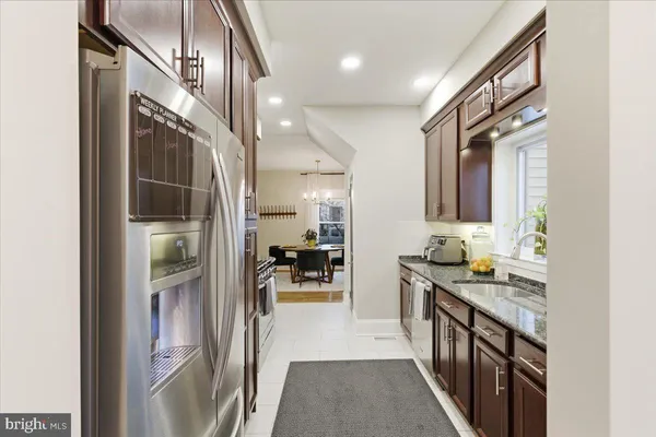 a view of a hallway view with wooden floor and staircase