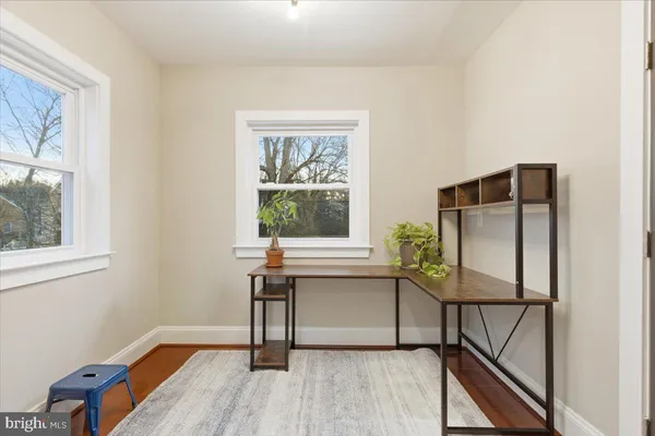 a view of a livingroom with furniture and a window