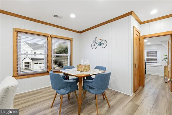 a view of a room with furniture window and wooden floor