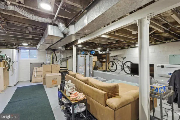 a living room with furniture and a view of chandelier