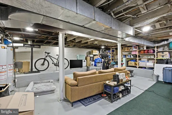 a area with furniture and a clock on wall