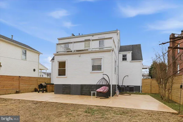 a view of a house with yard and sitting area