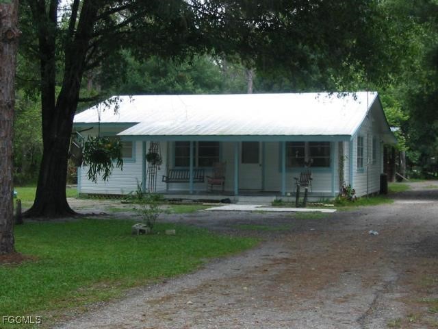 11631 Deal Road North Fort Myers, FL 33917 - Photo 1 of 30 front view of a house with a yard
