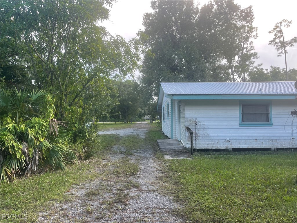 11631 Deal Road North Fort Myers, FL 33917 - Photo 23 of 30 a view of a house with a backyard