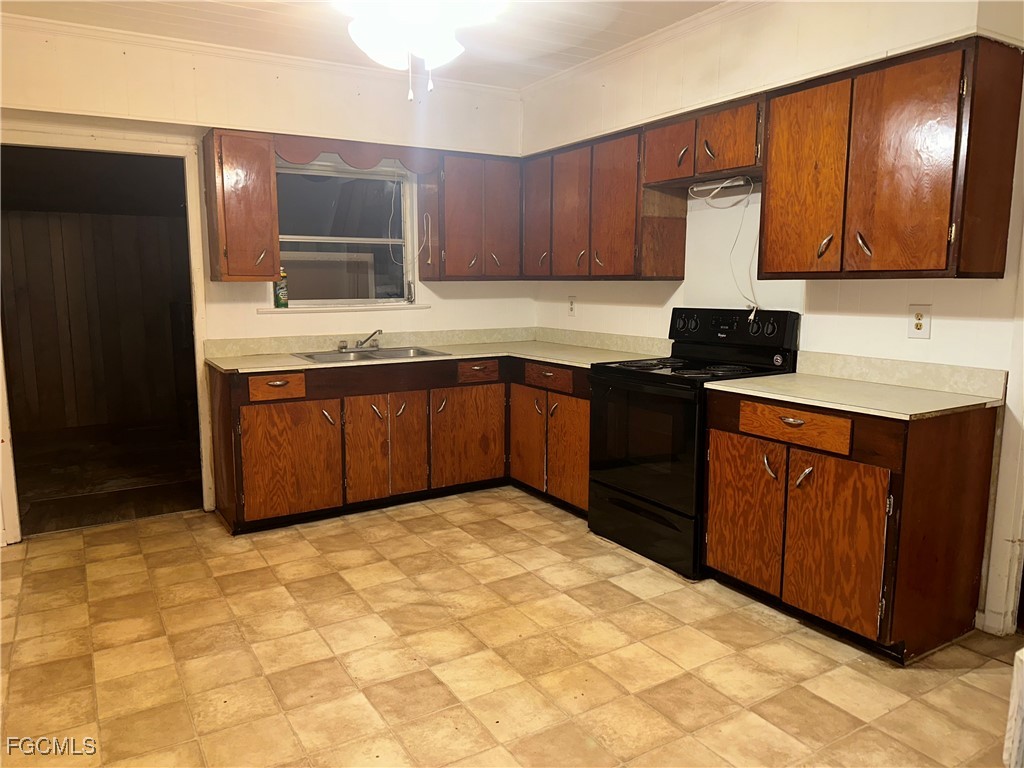 11631 Deal Road North Fort Myers, FL 33917 - Photo 4 of 30 a kitchen with stainless steel appliances granite countertop a sink stove and refrigerator