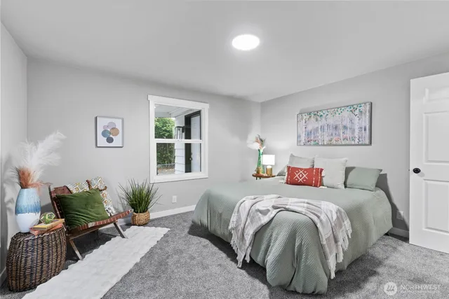 a bedroom with a bed and a couch