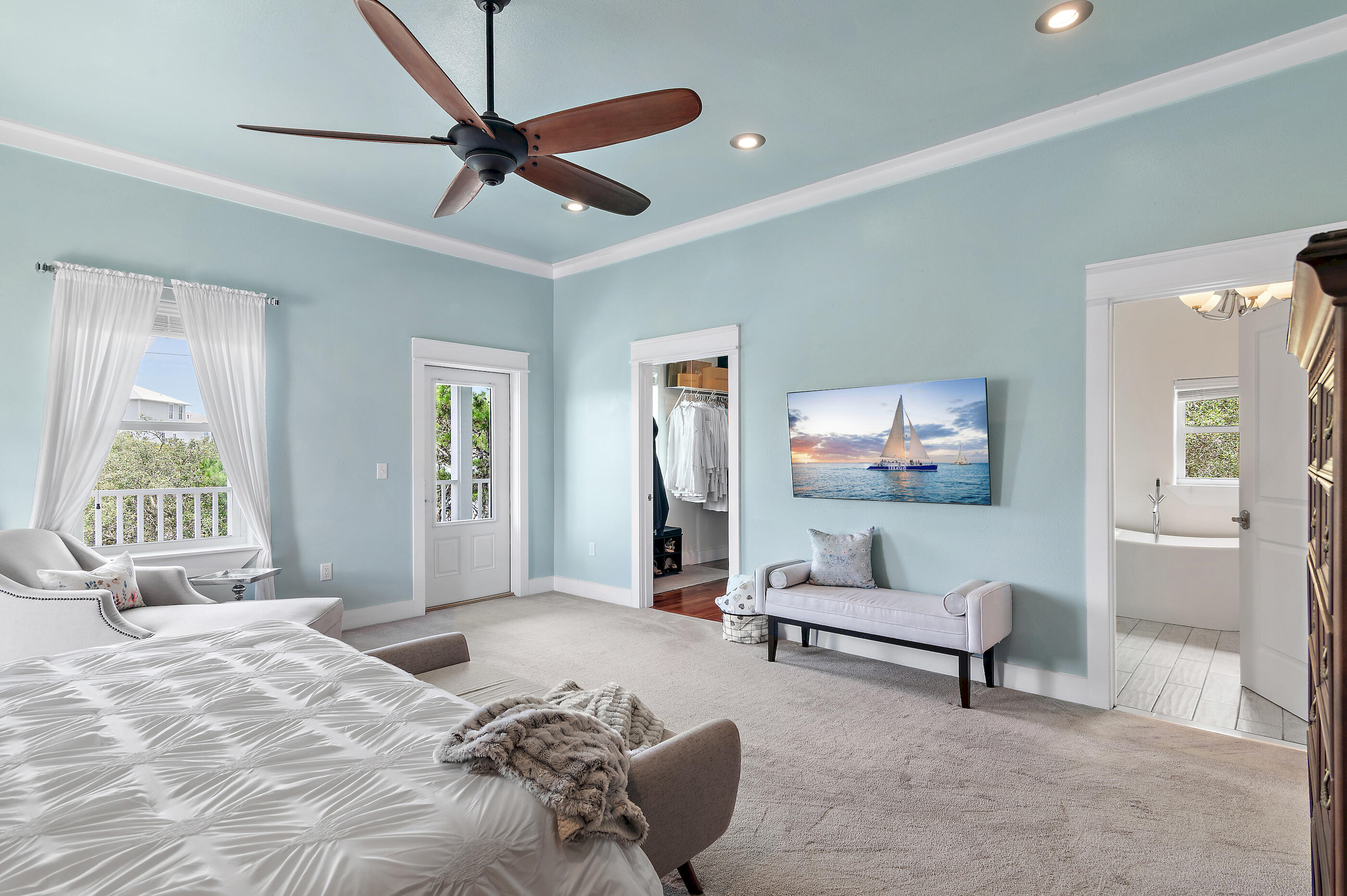 96 Hilltop Drive Santa Rosa Beach, FL 32459 - Photo 22 of 50 a bedroom with a bed and a chandelier