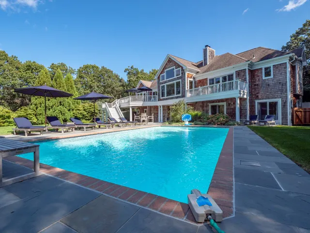 a view of a house with a swimming pool