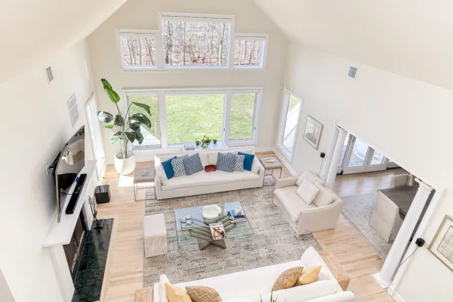 a living room with furniture and a large window
