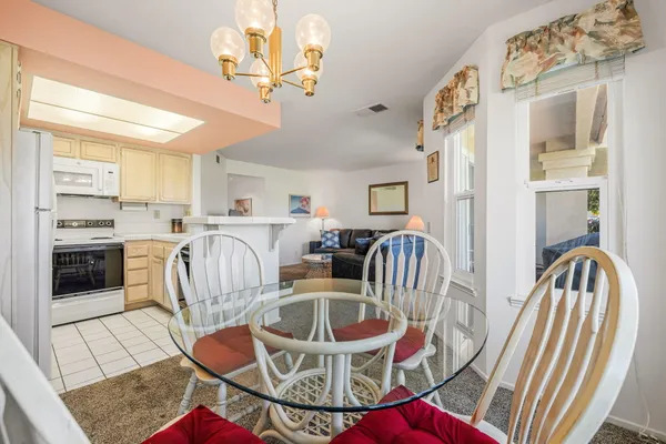 a kitchen with a sink and a stove top oven