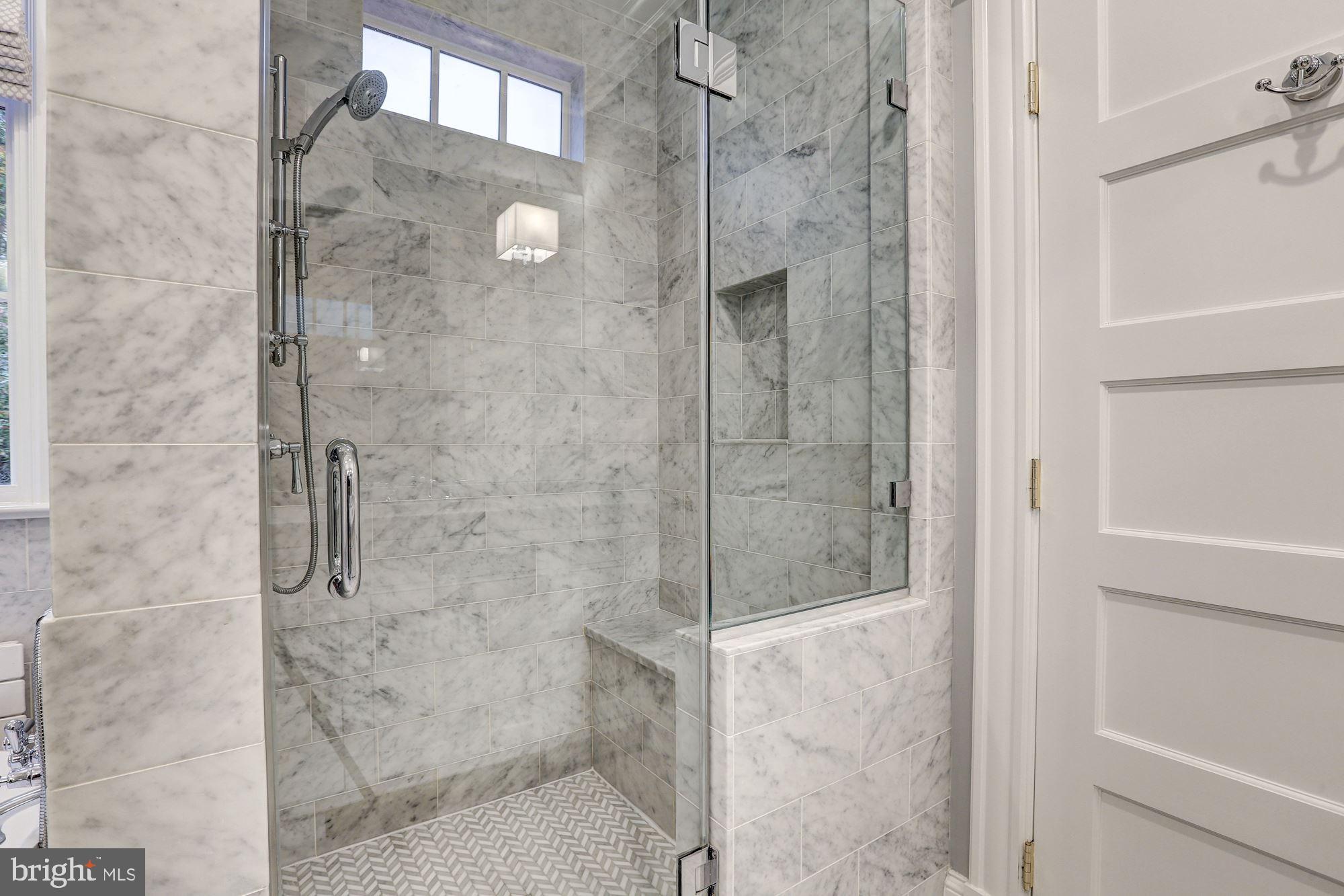 3307 Macomb Street Northwest Washington, DC 20008 - Photo 28 of 47 Marble-Tiled Walk-In Shower