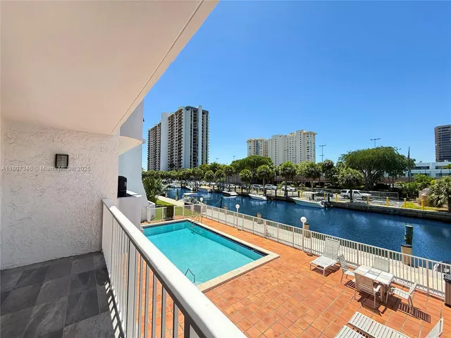 a view of a swimming pool with chairs