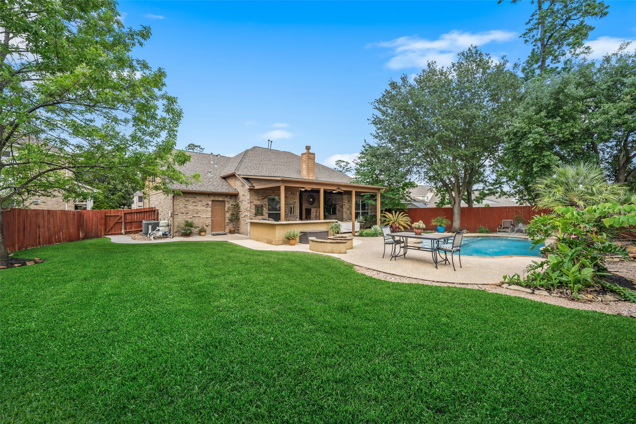6407 Ashley Manor Drive Spring, TX 77389 - Photo 36 of 41 a view of a house with a backyard porch and sitting area