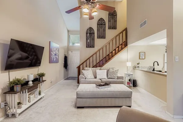 a living room with furniture and a flat screen tv