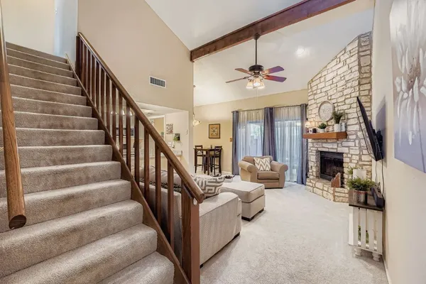 a view of entryway livingroom and hall with wooden floor