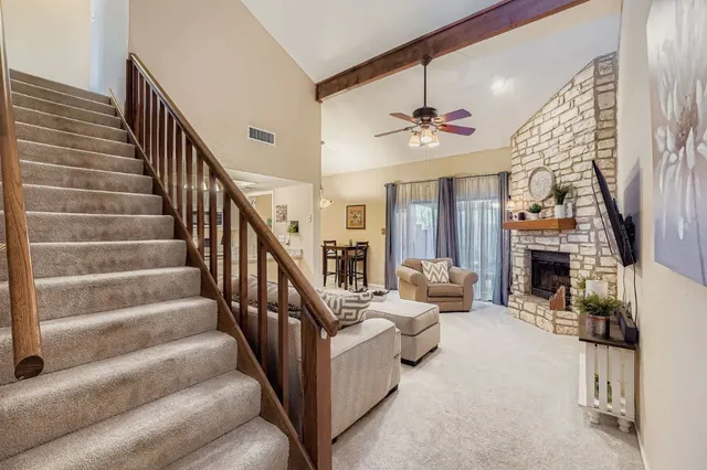 a view of entryway livingroom and hall with wooden floor