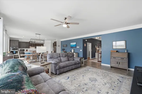 a large kitchen with a table and chairs