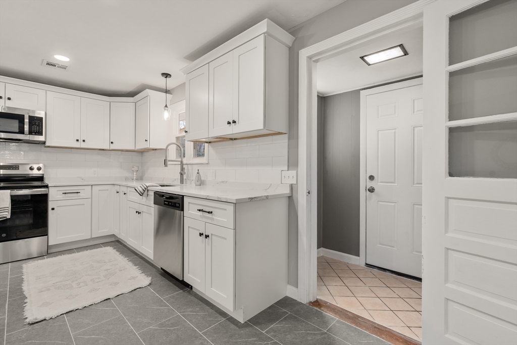 3 Mower Street Paxton, MA 01612 - Photo 12 of 36 a kitchen with white cabinets and white appliances