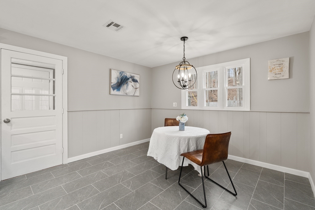 3 Mower Street Paxton, MA 01612 - Photo 14 of 36 a view of a dining room with furniture and chandelier