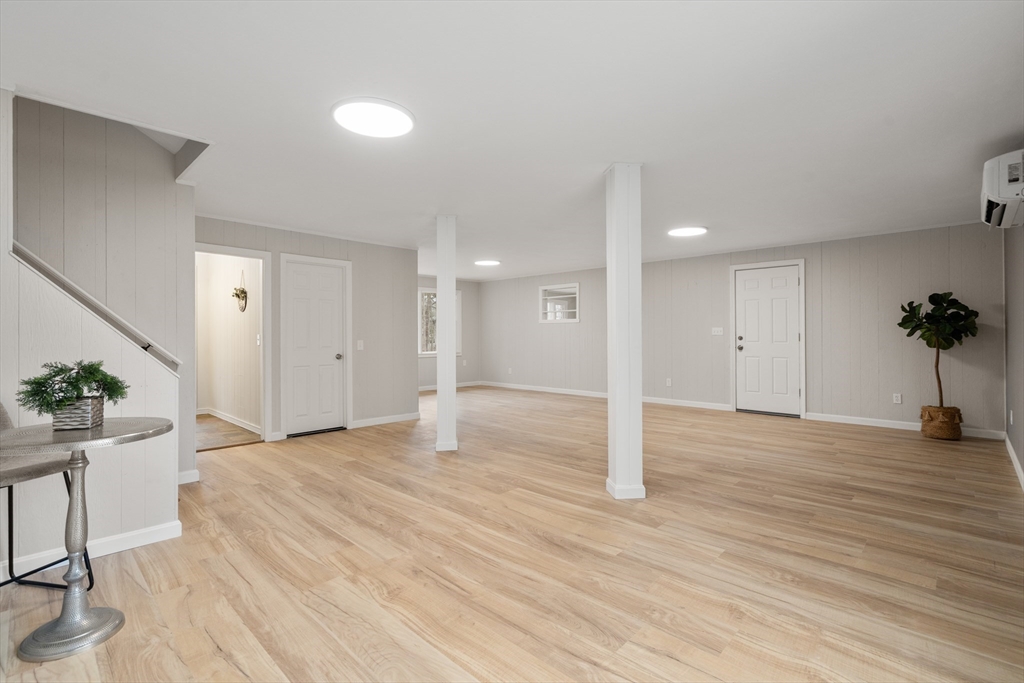 3 Mower Street Paxton, MA 01612 - Photo 15 of 36 an empty room with a potted plant and wooden floor