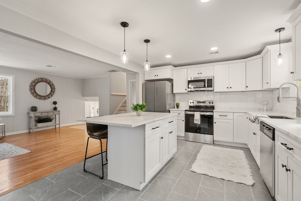 3 Mower Street Paxton, MA 01612 - Photo 23 of 36 a kitchen with stainless steel appliances kitchen island granite countertop a sink counter space cabinets and a window