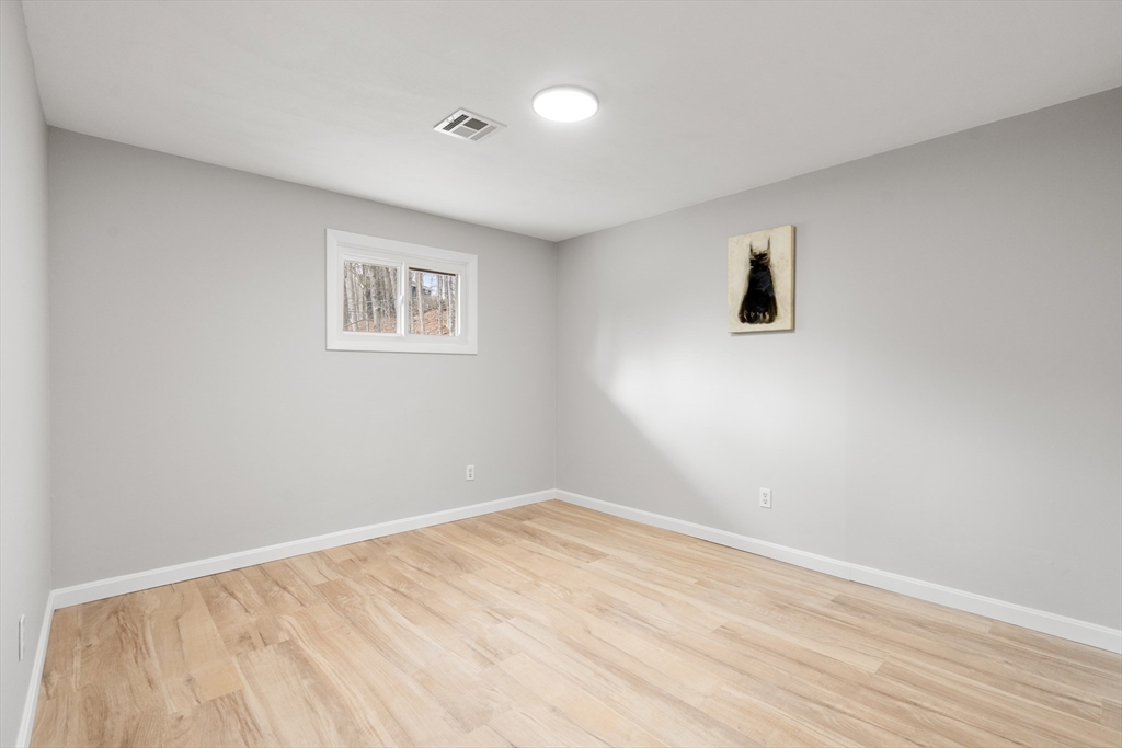 3 Mower Street Paxton, MA 01612 - Photo 27 of 36 a view of an empty room with wooden floor and a window