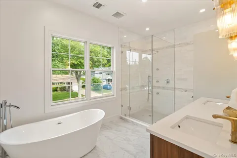 a bathroom with a bathtub and a sink
