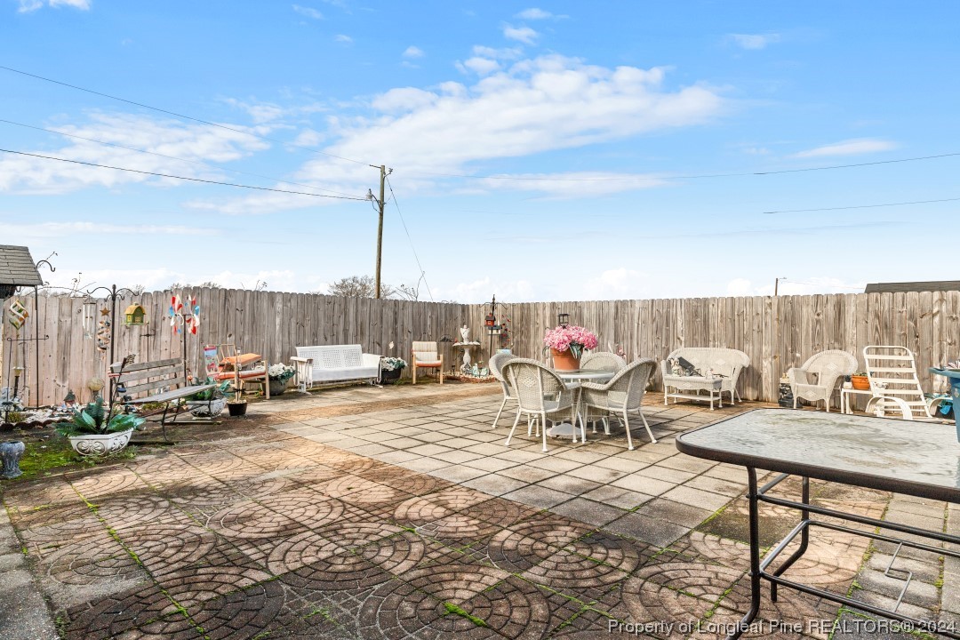 8571 Rhodes Pond Road Dunn, NC 28334 - Photo 17 of 18 a view of outdoor space with seating area