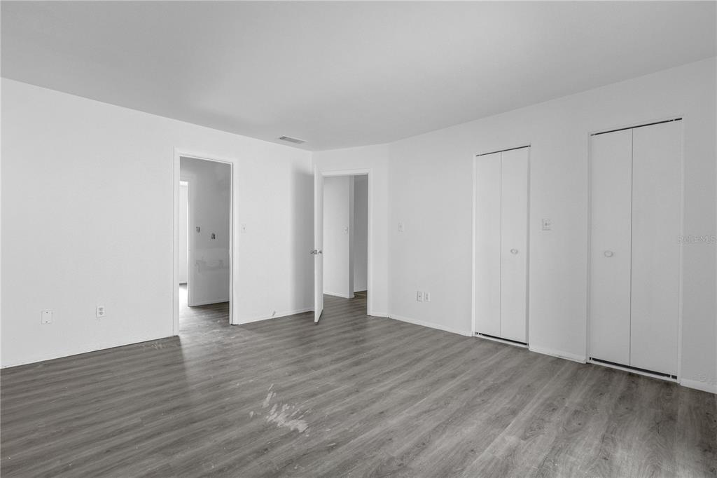 4025 Billingsgate Road, Unit 2004 Orlando, FL 32839 - Photo 14 of 23 a view of an empty room with wooden floor