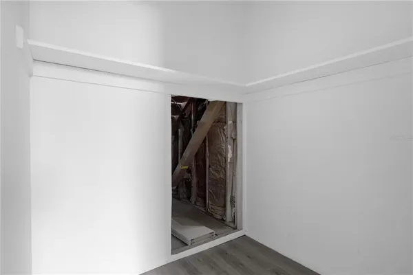 a view of walk in closet with clothes