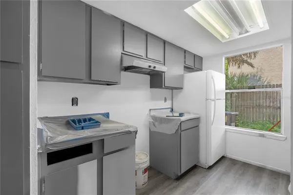 a kitchen with stainless steel appliances a stove a sink and a refrigerator