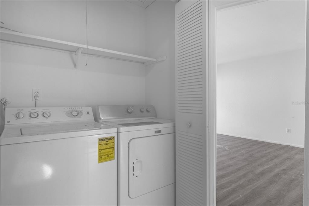 4025 Billingsgate Road, Unit 2004 Orlando, FL 32839 - Photo 9 of 23 a utility room with dryer and washer