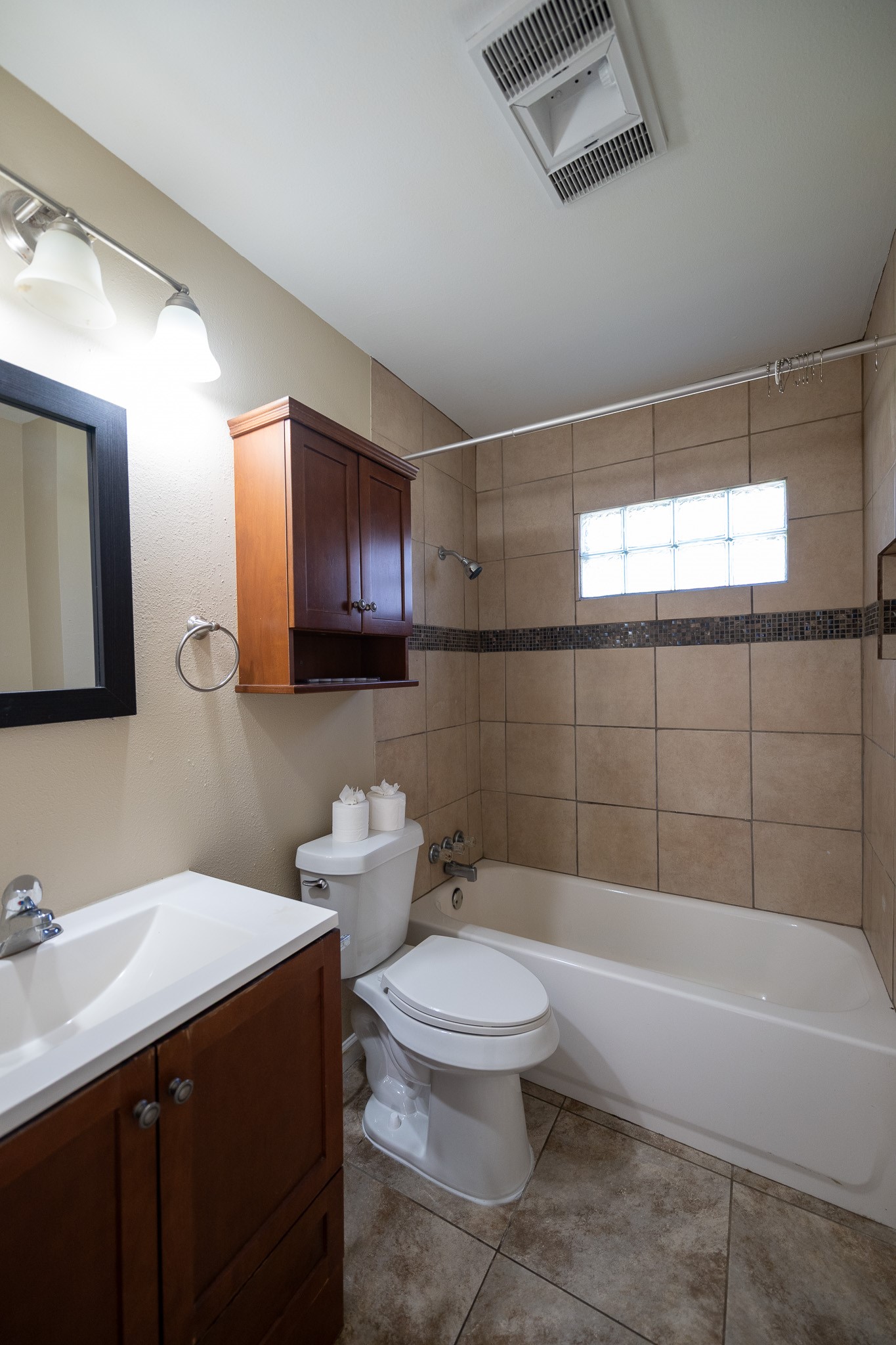 2304 Cedar Bayou Road Baytown, TX 77520 - Photo 11 of 14 a bathroom with a toilet a sink and bathtub