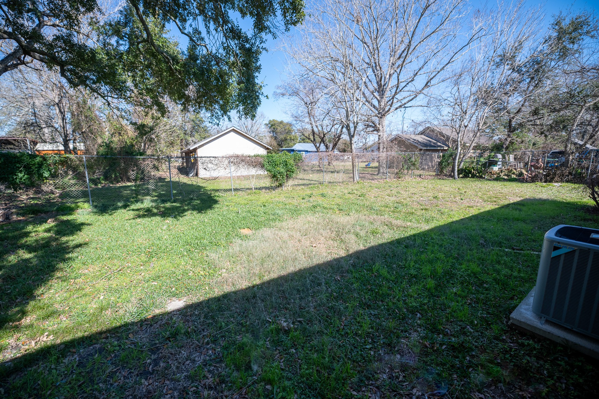 2304 Cedar Bayou Road Baytown, TX 77520 - Photo 14 of 14 a view of a backyard with large trees