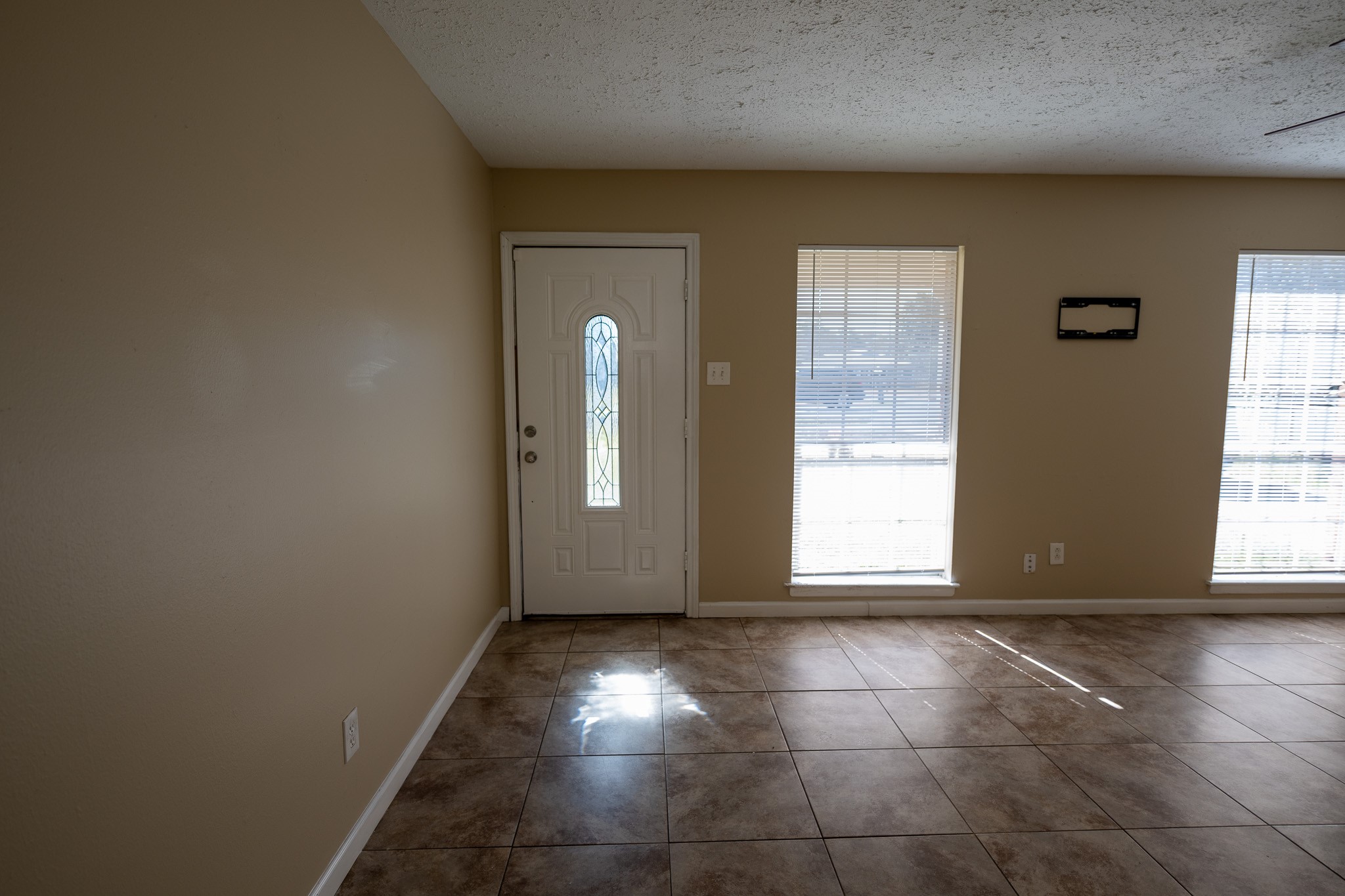 2304 Cedar Bayou Road Baytown, TX 77520 - Photo 2 of 14 a view of an empty room with a window