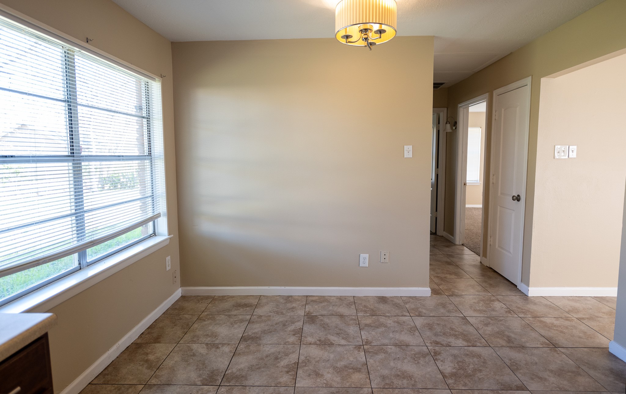 2304 Cedar Bayou Road Baytown, TX 77520 - Photo 8 of 14 a view of an empty room with a window