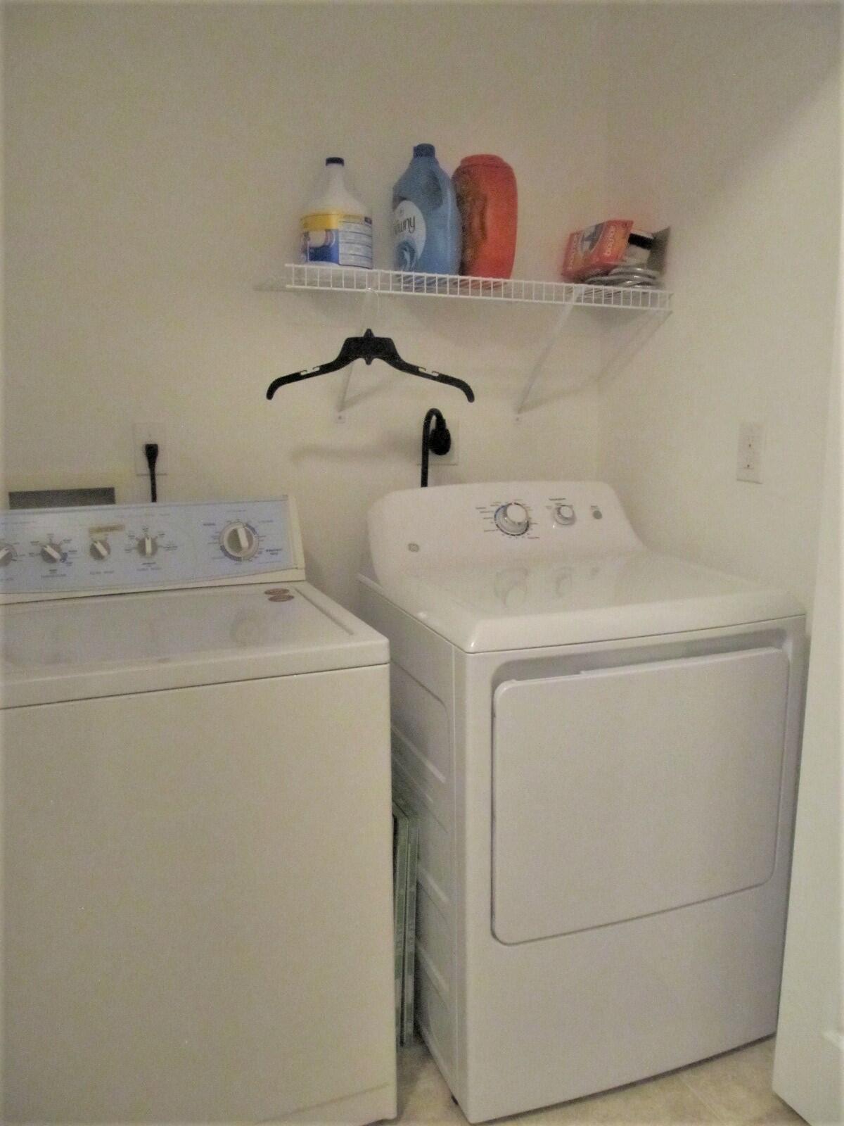 2795 Reston Street, Unit 104 Melbourne, FL 32935 - Photo 27 of 36 a utility room with dryer and washer