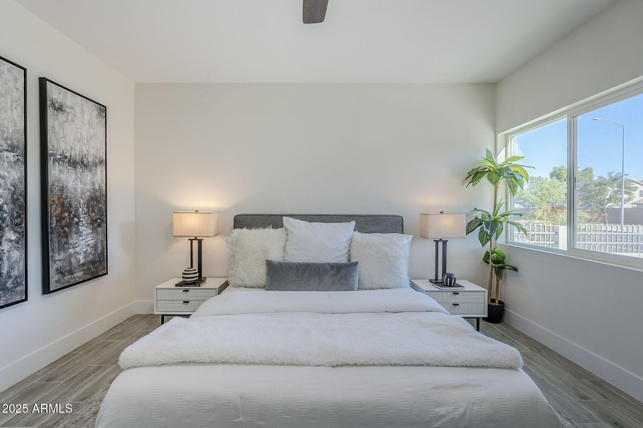 8644 West Mountain View Road Peoria, AZ 85345 - Photo 20 of 35 a bedroom with a bed and a lamp