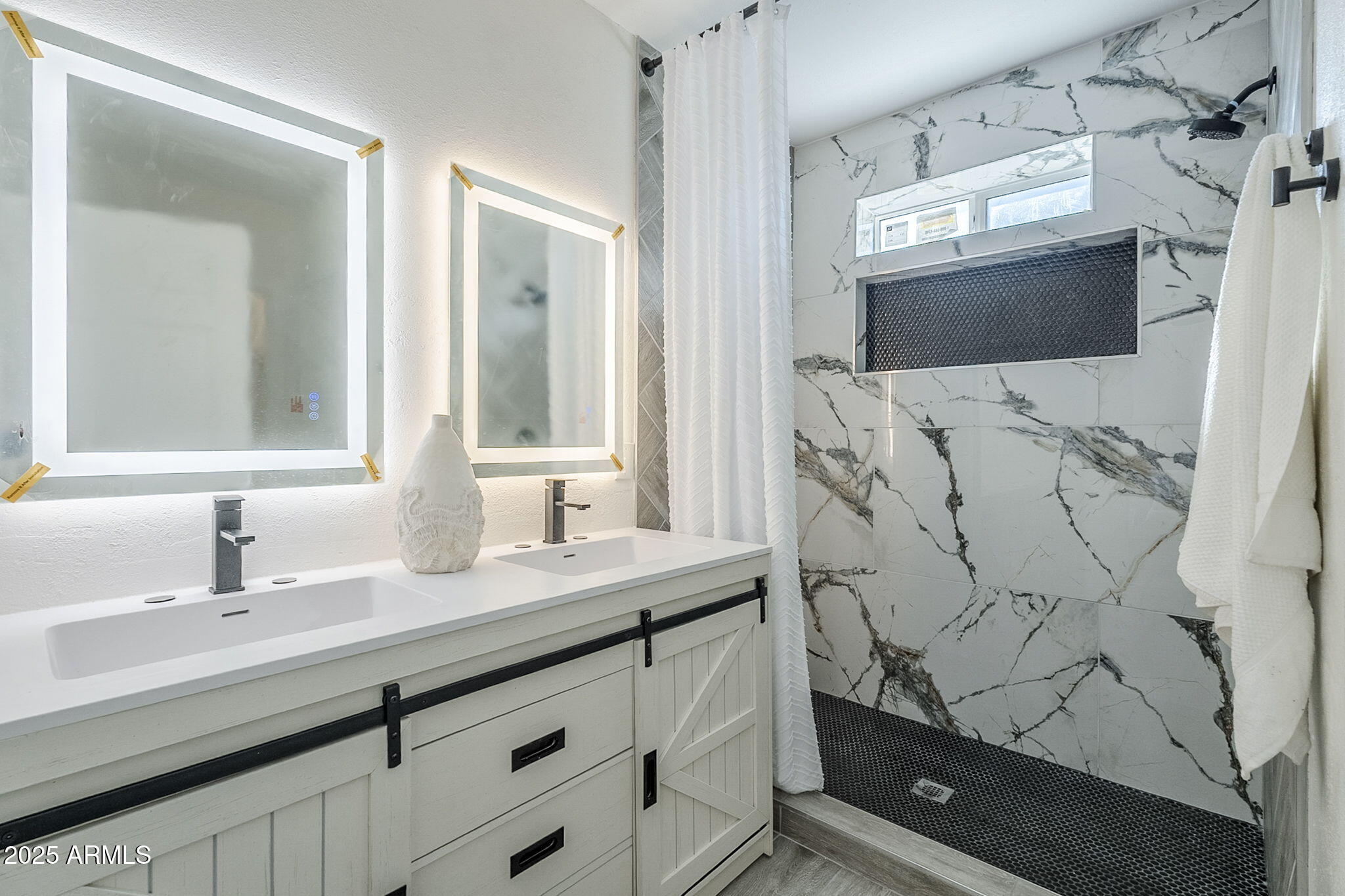 8644 West Mountain View Road Peoria, AZ 85345 - Photo 24 of 35 a bathroom with a sink vanity and mirror