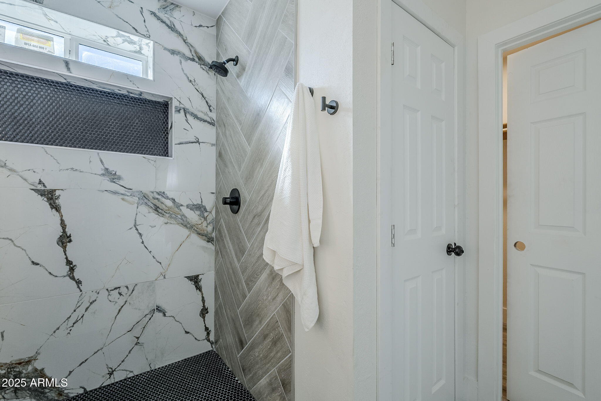 8644 West Mountain View Road Peoria, AZ 85345 - Photo 25 of 35 a bathroom with a shower