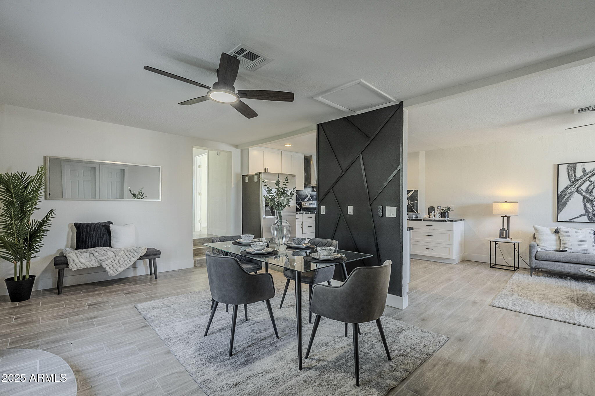 8644 West Mountain View Road Peoria, AZ 85345 - Photo 3 of 35 a view of a livingroom with furniture and a potted plant