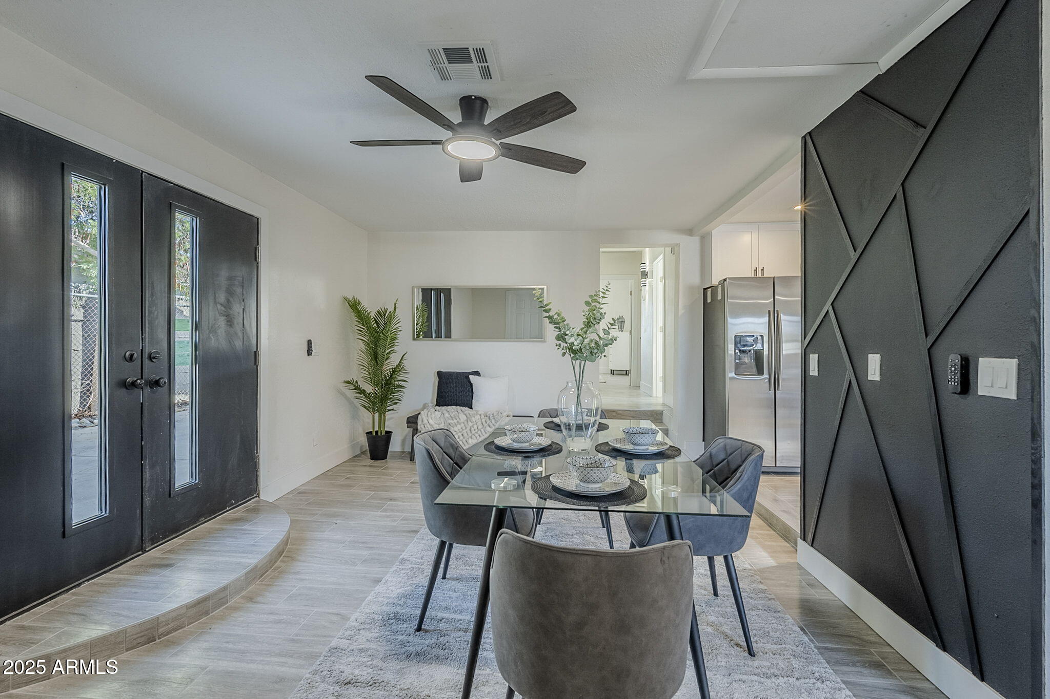 8644 West Mountain View Road Peoria, AZ 85345 - Photo 4 of 35 a view of a dining room with furniture and a potted plant