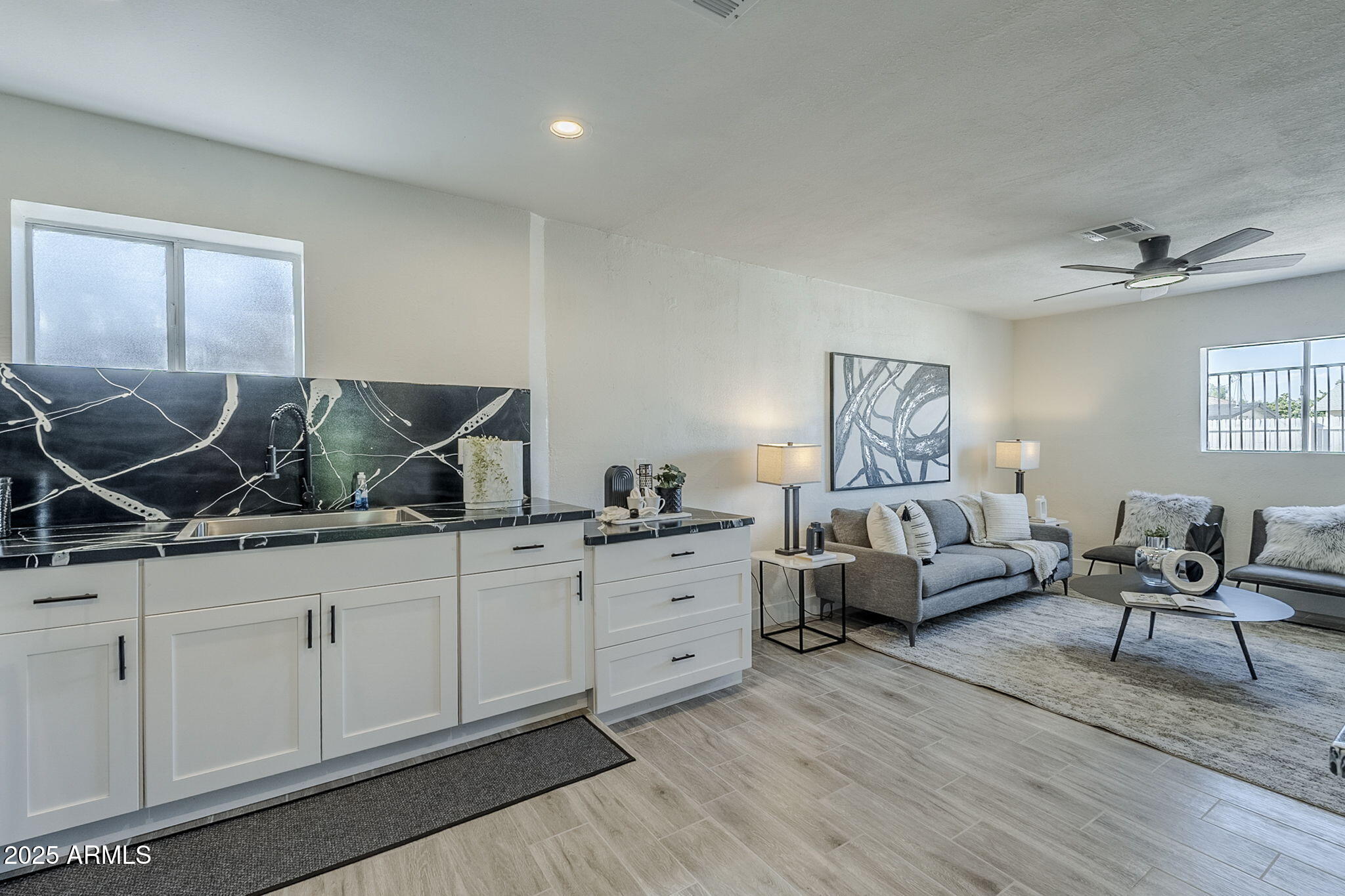 8644 West Mountain View Road Peoria, AZ 85345 - Photo 7 of 35 a living room with furniture and wooden floor