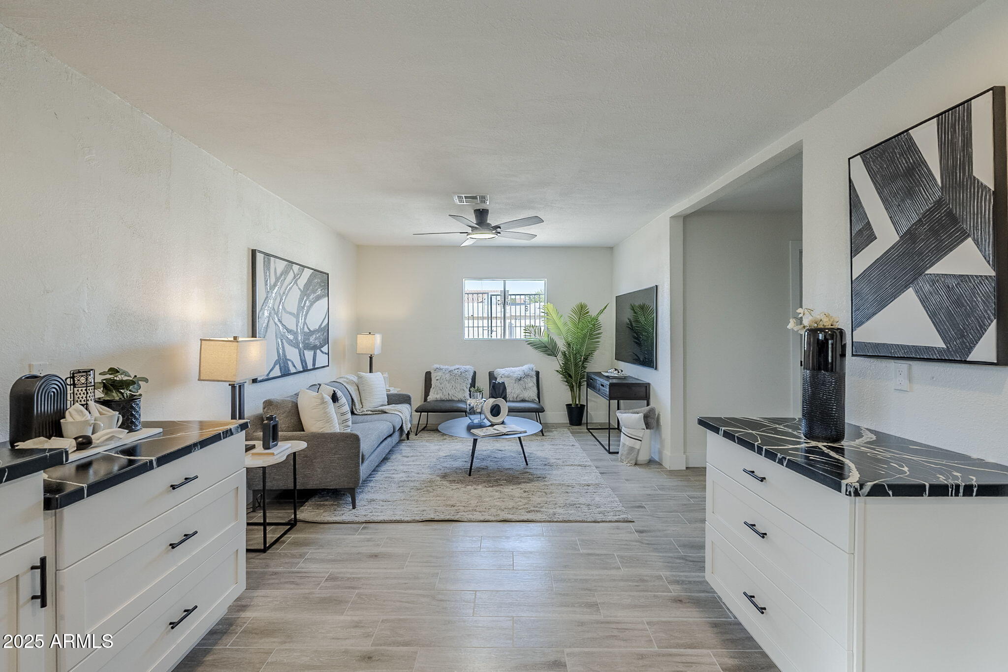 8644 West Mountain View Road Peoria, AZ 85345 - Photo 8 of 35 a living room with furniture windows and a flat screen tv